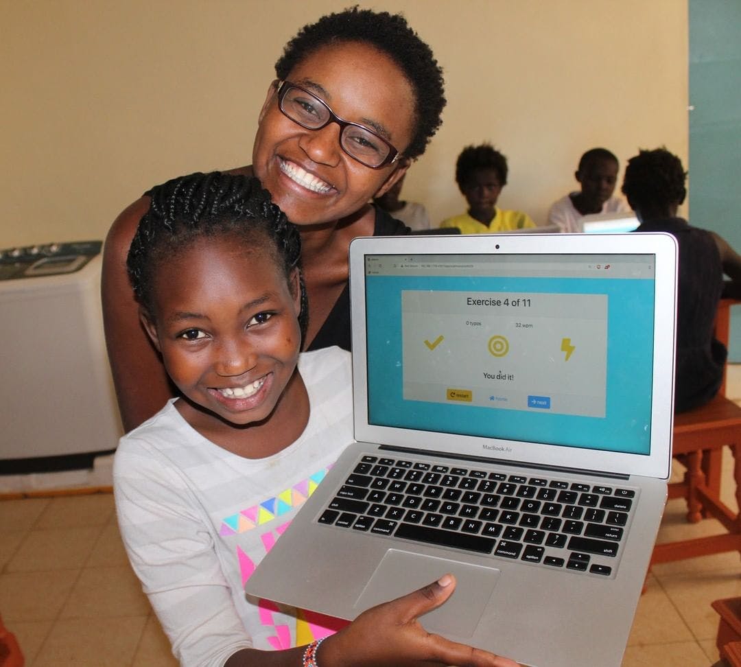 Leili and Nelly celebrating a perfect touch-typing lesson