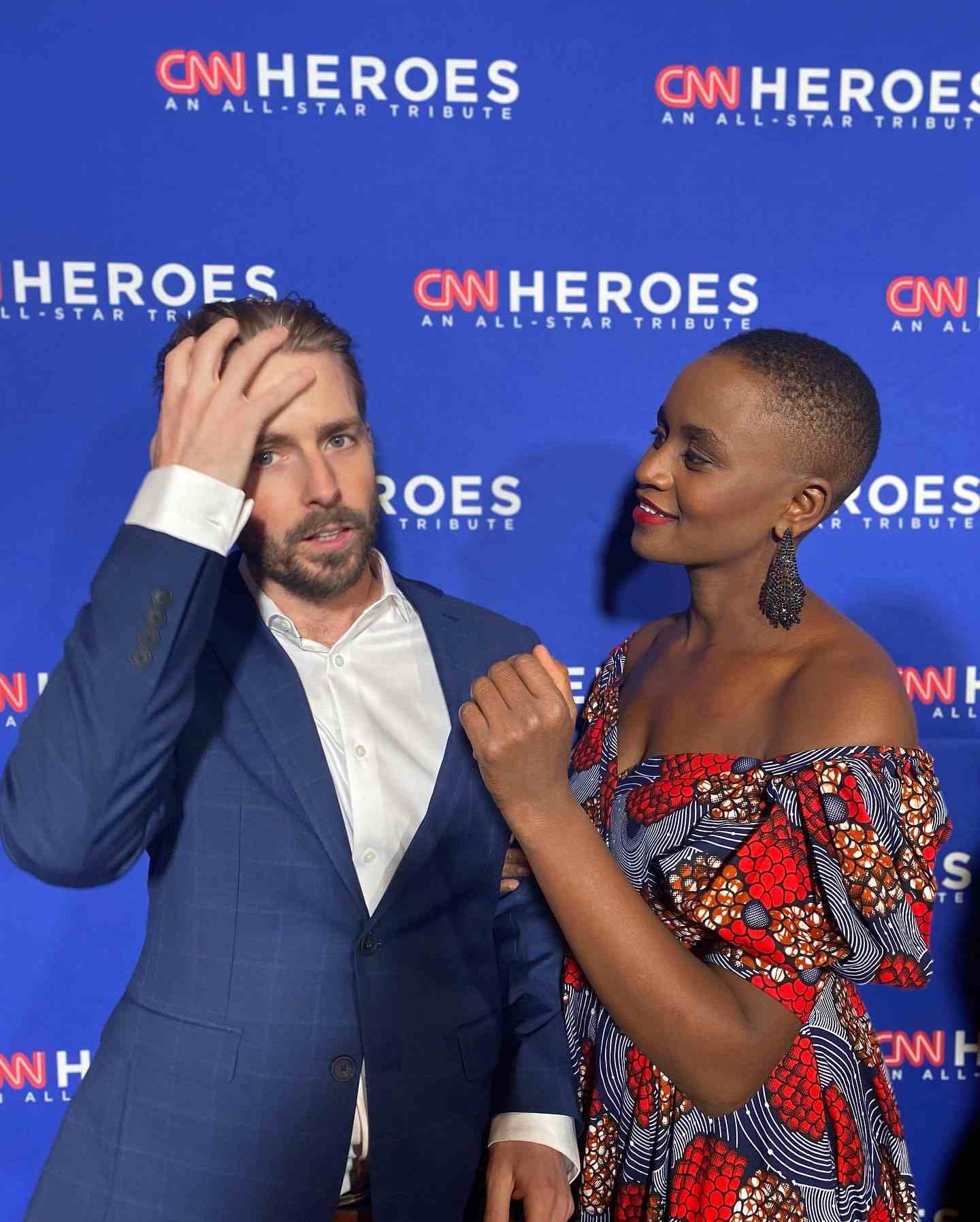A side Portrait Nelly Cheboi and Tyler Cinnamon at the CNN Heroes red carpet