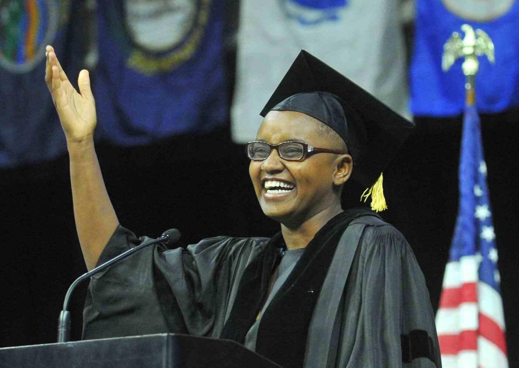 Nelly Cheboi at Augustana Commencement podium laughing