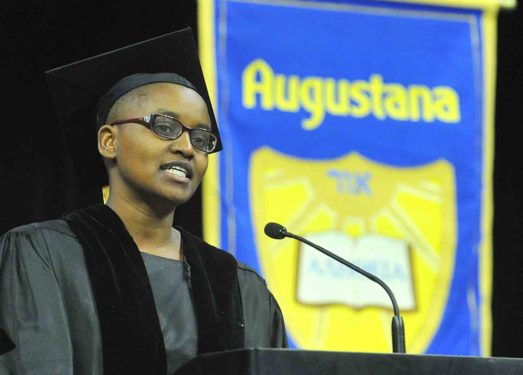 Nelly Cheboi at Augustana commencement at the podium with a stern look
