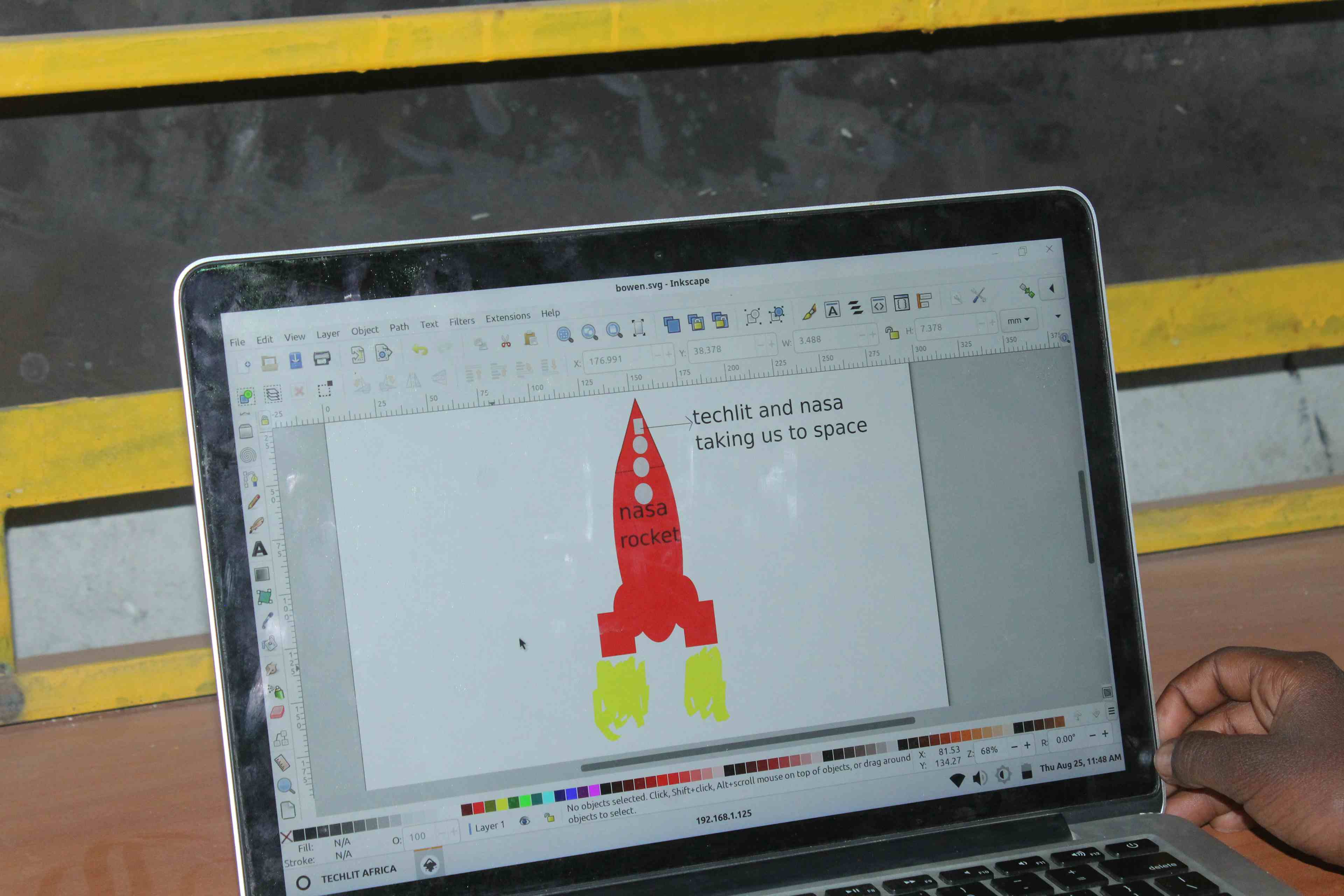 An Inkscape screen showing a rocket with works TechLit and Nasa taking us to space