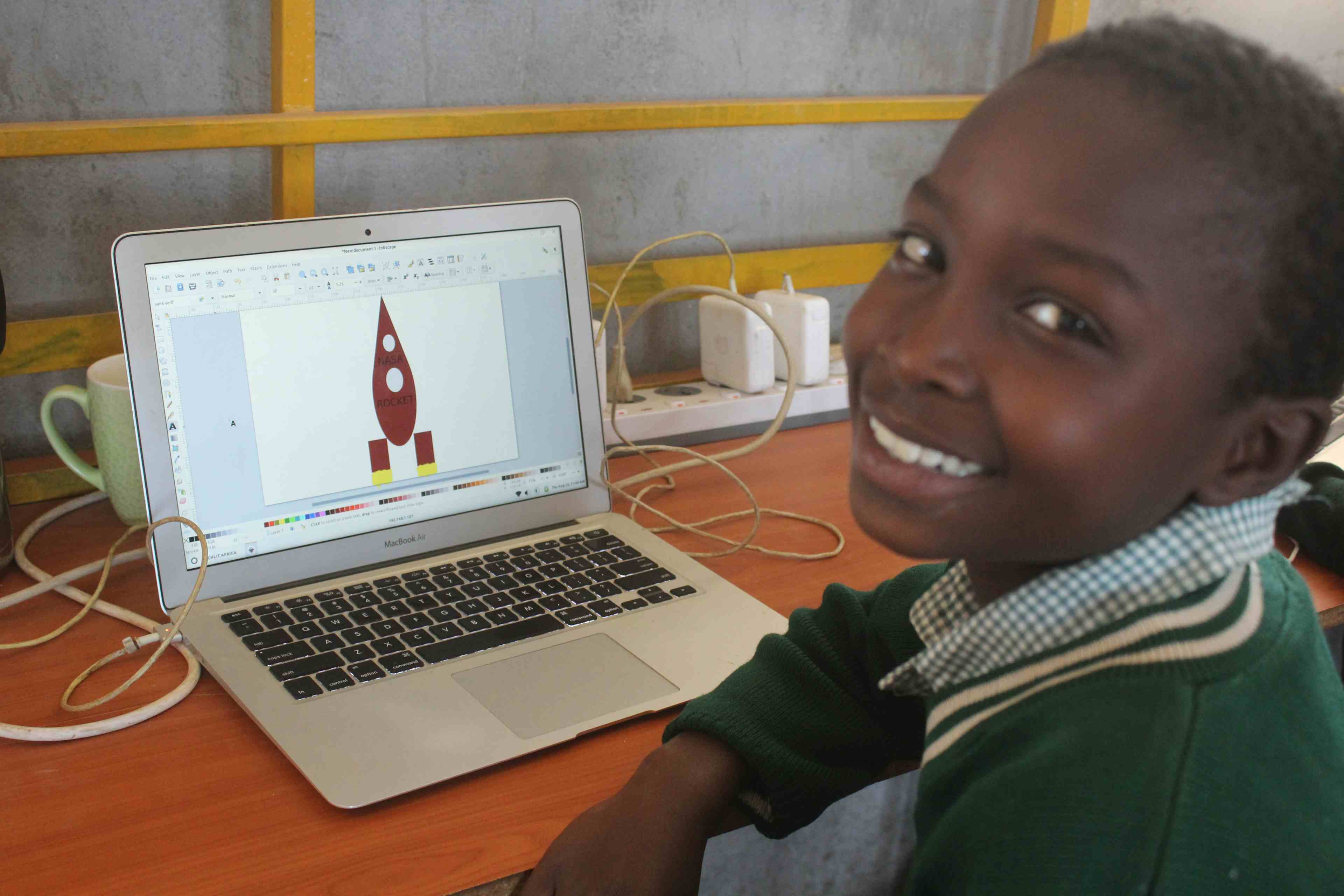 Rono showing his rocket on the screen at TechLit computer lab