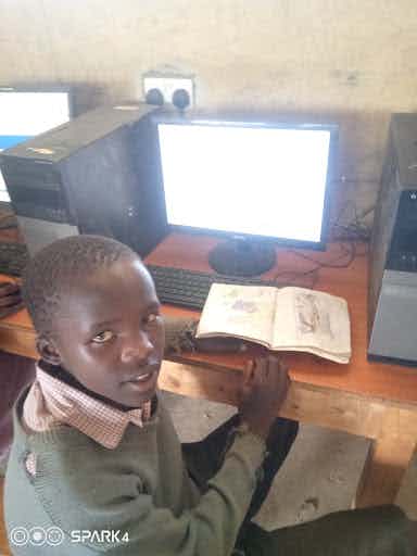6th Grader at a Computer in Barina Primary School