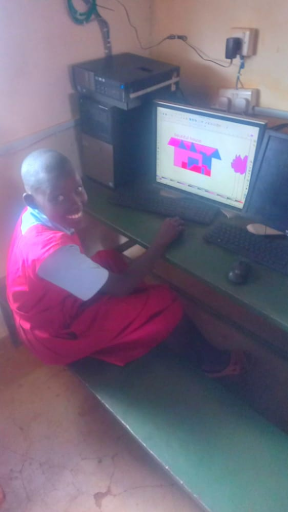 Primary Schools Confident Student Pink Uniform At Computer
