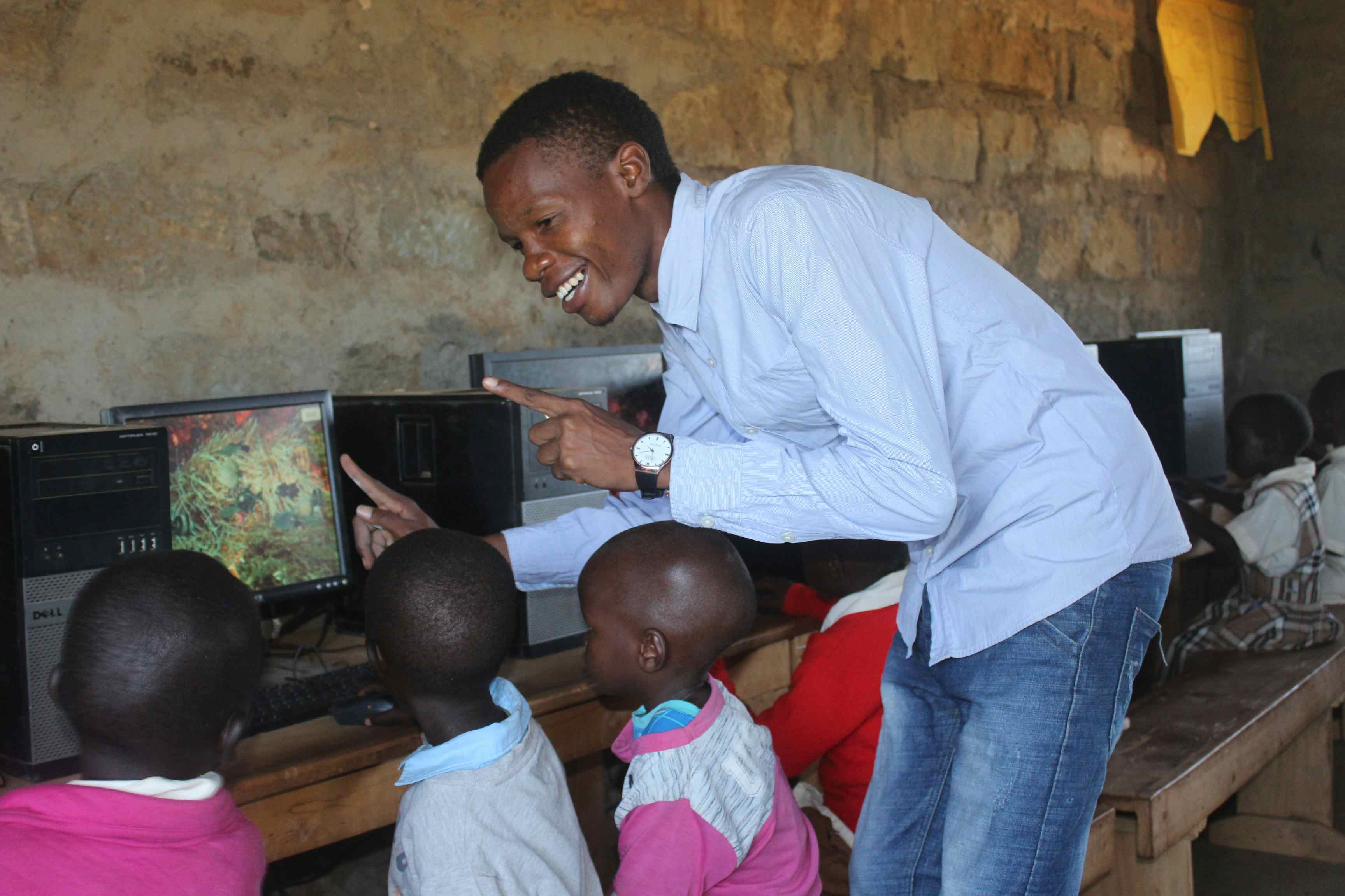 Stanley Kipkurui Teaching Computer Class in Primary School