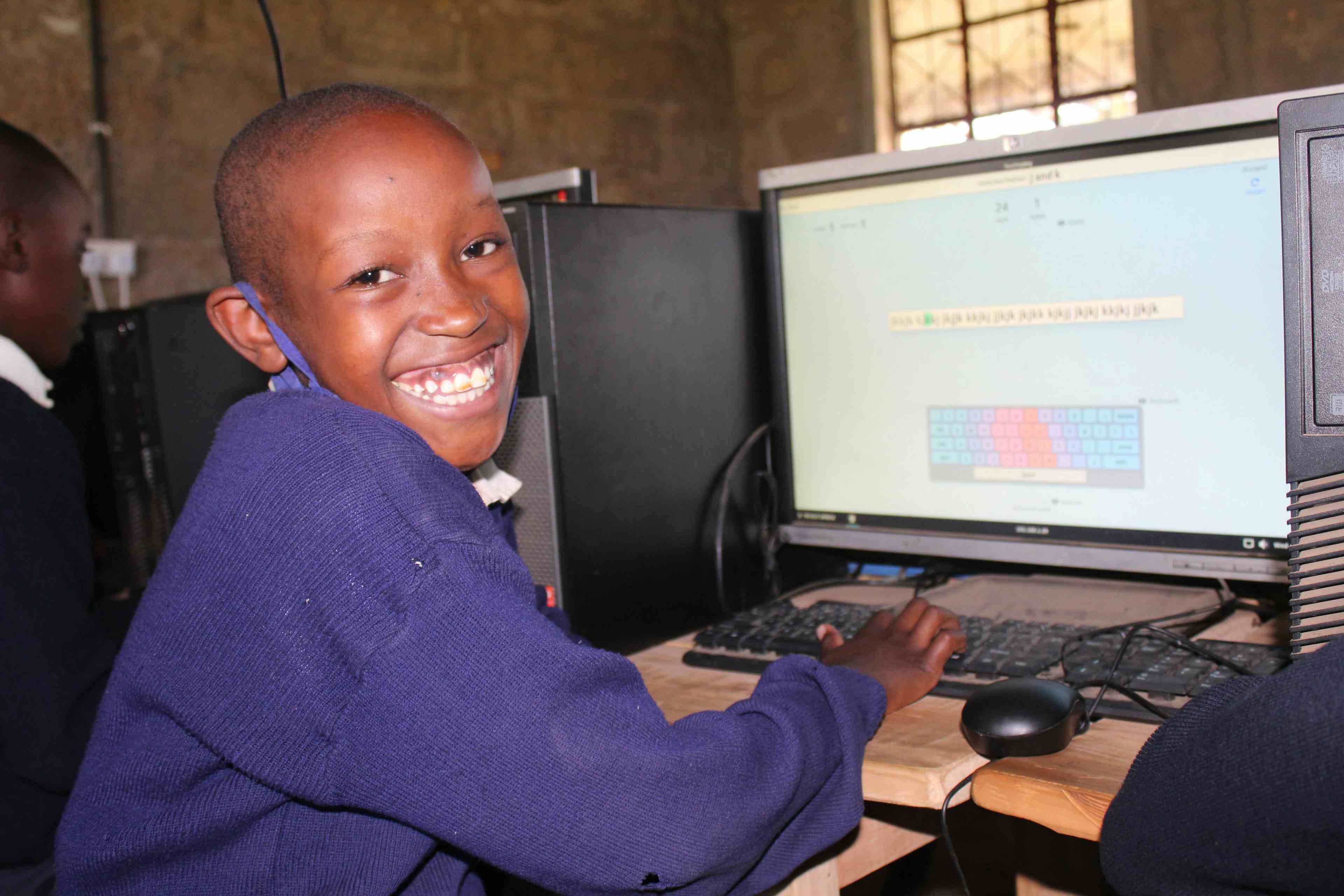  Gloria Wangui Sitting At Sainty Mary's computer lab Touch Typing